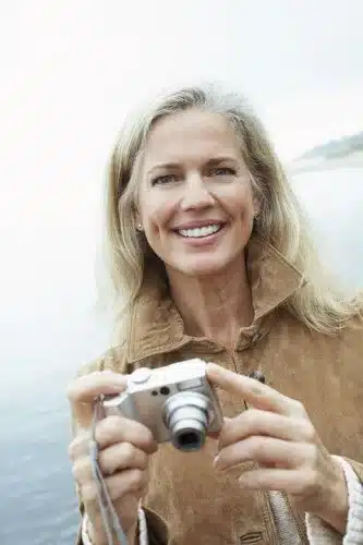 dental implant smiling older woman camera