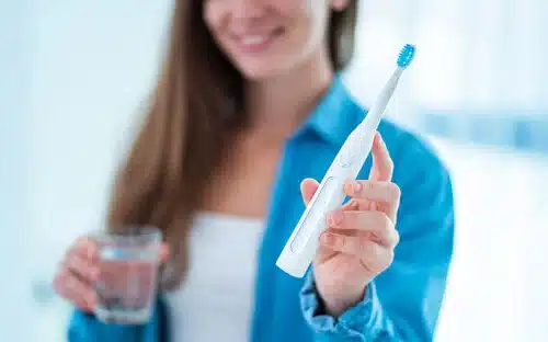 electric toothbrush woman handheld