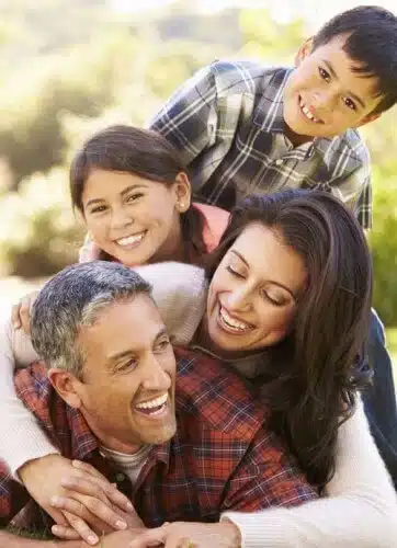 family piled on dad laughing web