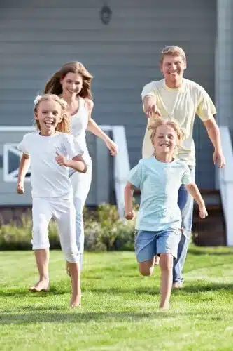 family playing tag outdoors web