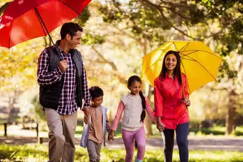 family with umbrellas web