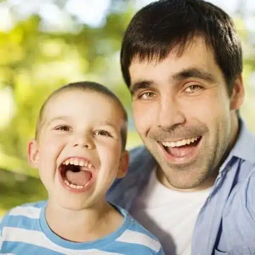 father and son nature selfie open mouths