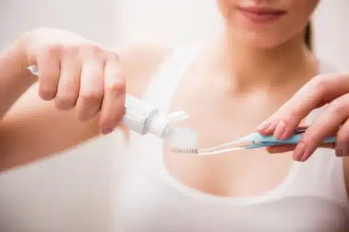 girl with toothbrush paste