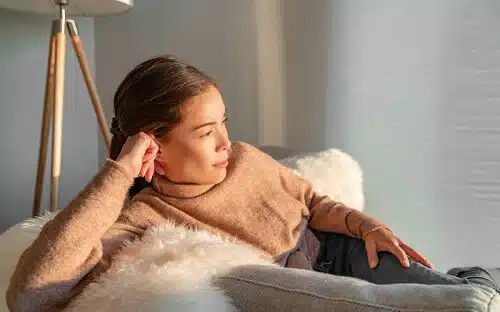 woman sitting looking window