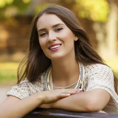 woman smiling in park