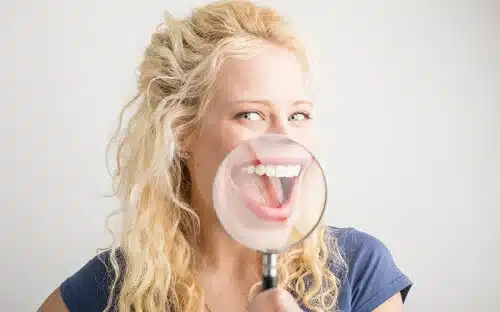 woman smiling magnifyingglass