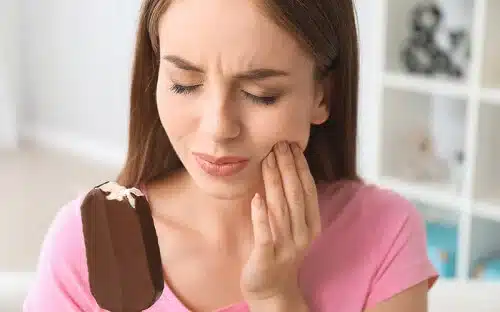 woman with tooth pain popsicle